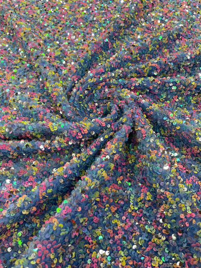 Multi color Confetti all over shiny sequins on light blue stretch velvet , Sold by the yard