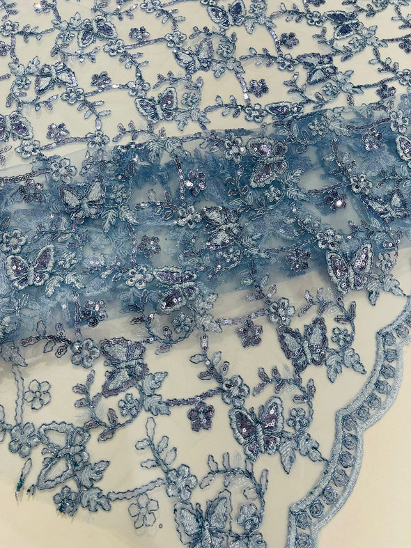 Light Blue Corded Lace/Small Butterfly Design Embroidered with Sequin on a Mesh Lace Fabric.