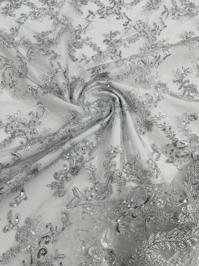Silver Metallic Flower lace corded and embroider with sequins on a mesh- Sold by the yard