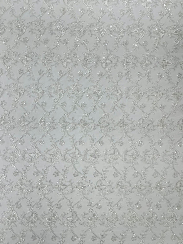 White Corded Lace/Small Butterfly Design Embroidered with Sequin on a Mesh Lace Fabric.