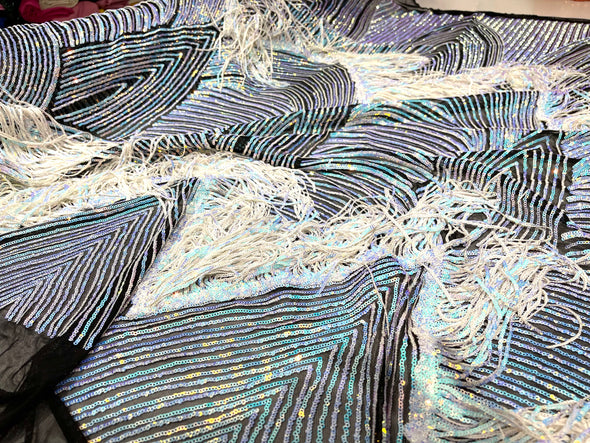 Aqua Blue Iridescent fringe sequins design on a Black 4 way stretch mesh fabric sold by the yard.