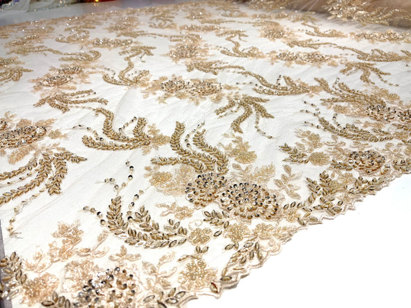 Light Peach flowers embroider and heavy beaded on a mesh lace fabric-sold by the yard.