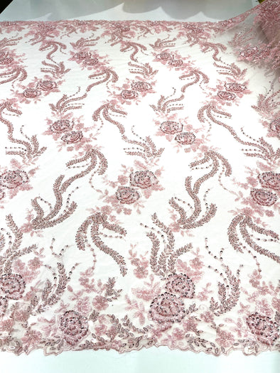 Pink flowers embroider and heavy beaded on a mesh lace fabric-sold by the yard.