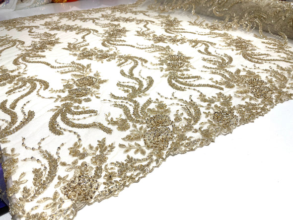 Light Gold flowers embroider and heavy beaded on a mesh lace fabric-sold by the yard.