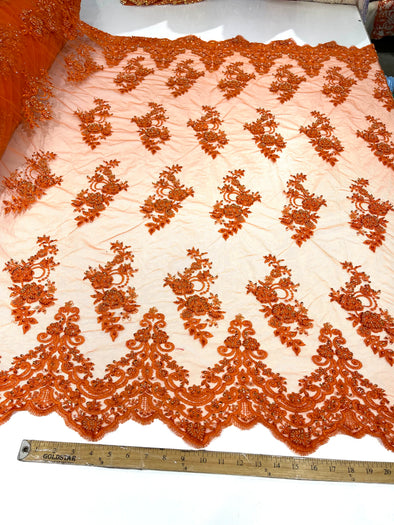 Orange elegant hand beaded flower design embroider on a mesh lace-prom-sold by the yard