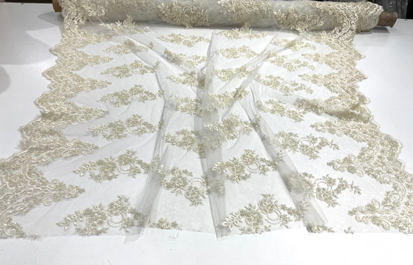 Ivory elegant hand beaded flower design embroider on a mesh lace-prom-sold by the yard