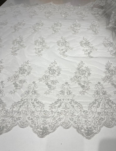 White elegant hand beaded flower design embroider on a mesh lace-prom-sold by the yard