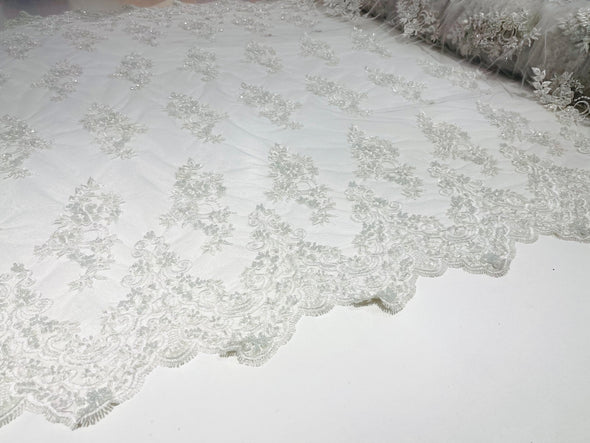 White elegant hand beaded flower design embroider on a mesh lace-prom-sold by the yard