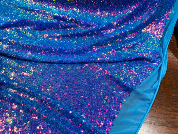 Purple/ Turquoise Iridescent Mini Glitz Sequins on a Turquoise 4 Way Stretch Mesh-Sold  By The Yard.