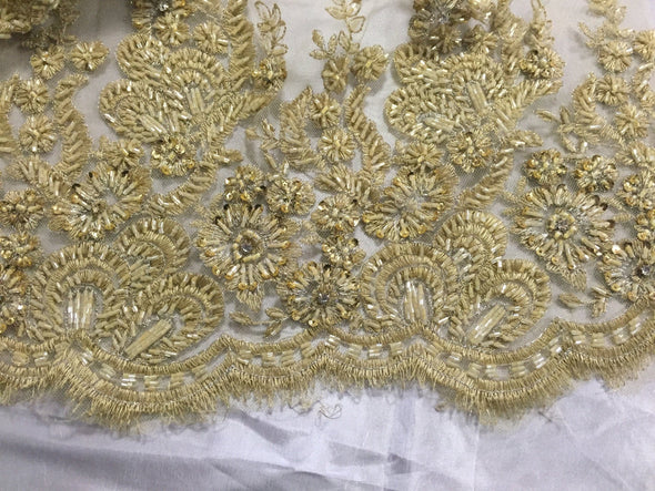 Gold flowers embroider and heavy beaded on a mesh lace fabric-sold by the yard-