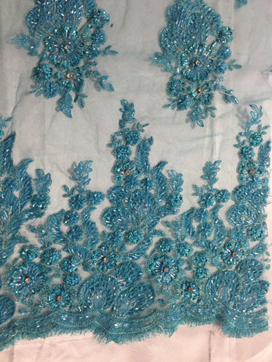 Aqua flowers embroider and heavy beaded on a mesh lace fabric-sold by the yard-