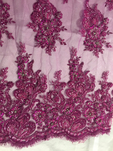 Magenta flowers embroider and heavy beaded on a mesh lace fabric-sold by the yard-