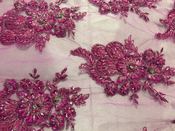 Magenta flowers embroider and heavy beaded on a mesh lace fabric-sold by the yard-