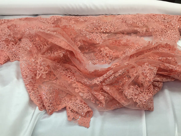 Coral flower lace corded and embroider with sequins on a mesh. Wedding/bridal/prom/nightgown fabric. Sold by the yard.