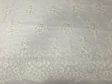 Ivory royal flowers embroider with sequins and corded on a mesh lace -yard