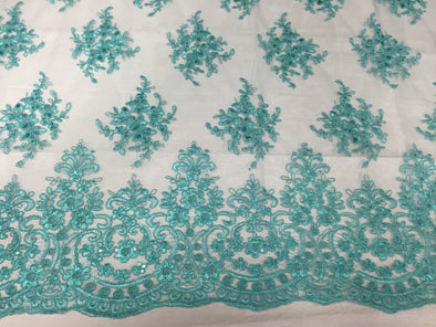 Aqua royal flowers embrodier with sequins and corded on a mesh lace-yard