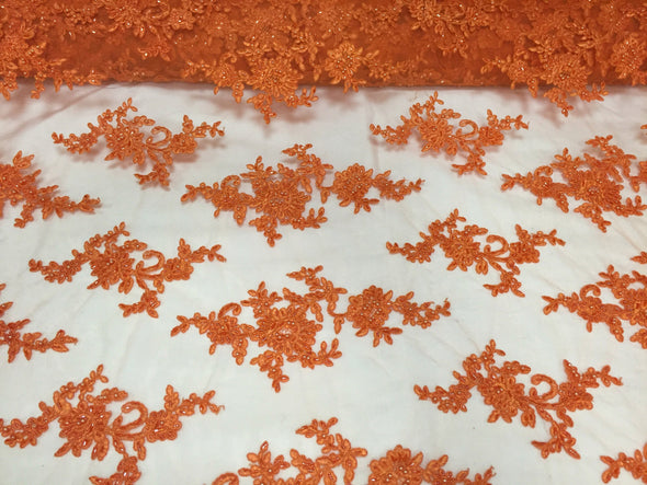 Orange appealing flower design embroider and beaded on a mesh lace-yard
