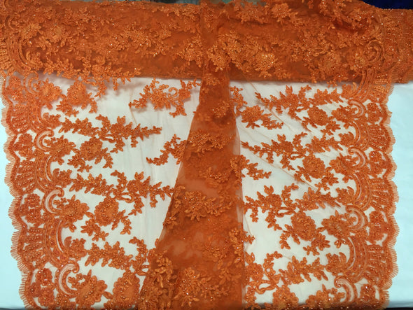 Orange appealing flower design embroider and beaded on a mesh lace-yard