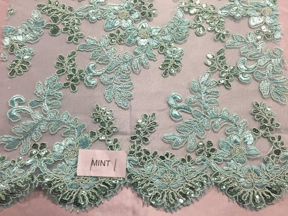 Mint corded flowers embroider with sequins on mesh lace fabric - yard