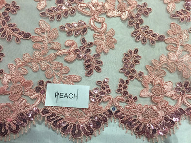 Peach corded flowers embroided with sequins on mesh lace fabric - yard