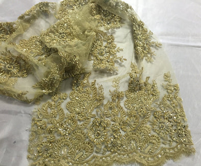 Gold flowers embroider and heavy beaded on a mesh lace fabric-sold by the yard-