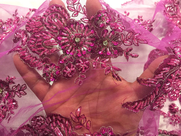 Magenta flowers embroider and heavy beaded on a mesh lace fabric-sold by the yard-