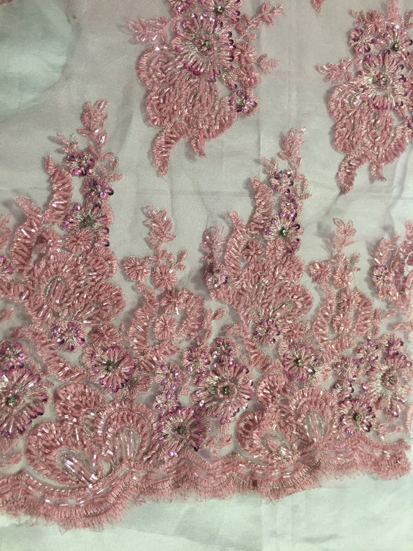 Dusty rose flowers embroider and heavy beaded on a mesh lace fabric-sold by the yard-