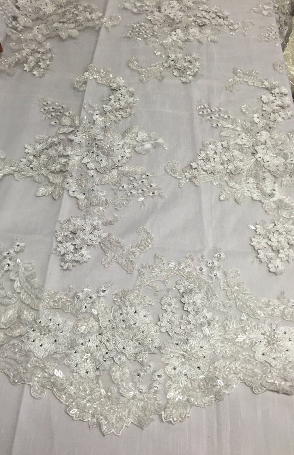 white lavish 3D flowers embroider with sequins and beaded on a mesh lace-prom-nightgown-decorations-wedding-bridal-dresses-sold by the yard.