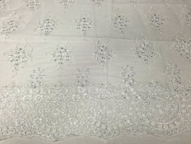 White Royal flowers design embroider with sequins and corded on a mesh lace-Sold by the yard