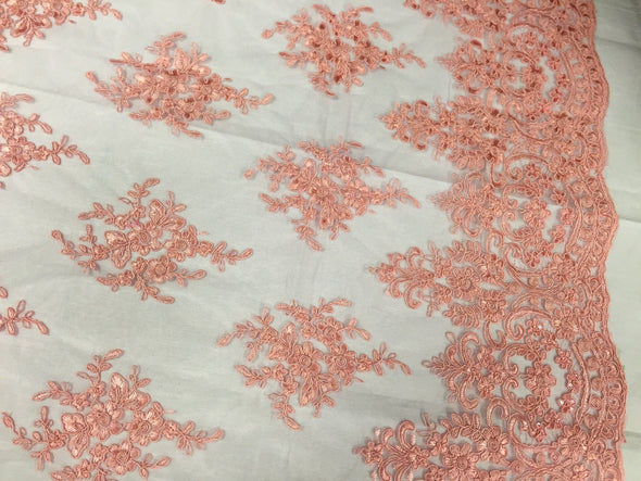 Coral royal flowers embroider with sequins and corded on a mesh lace-yard