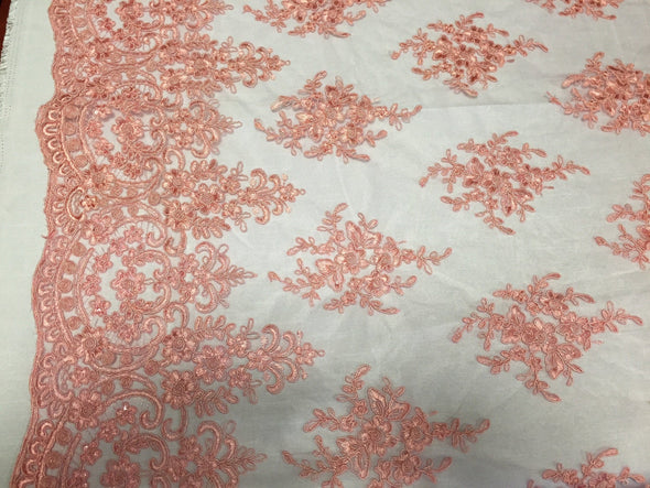 Coral royal flowers embroider with sequins and corded on a mesh lace-yard