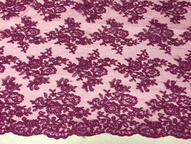 Fuchsia Modern roses embroider and corded on a mesh lace -Sold by the yard