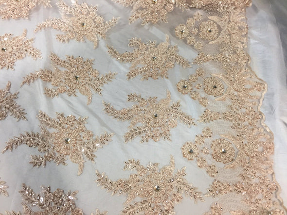 Skin imperial design embroider and beaded on a mesh lace -yd