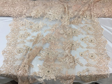 Skin imperial design embroider and beaded on a mesh lace -Sold by the yard