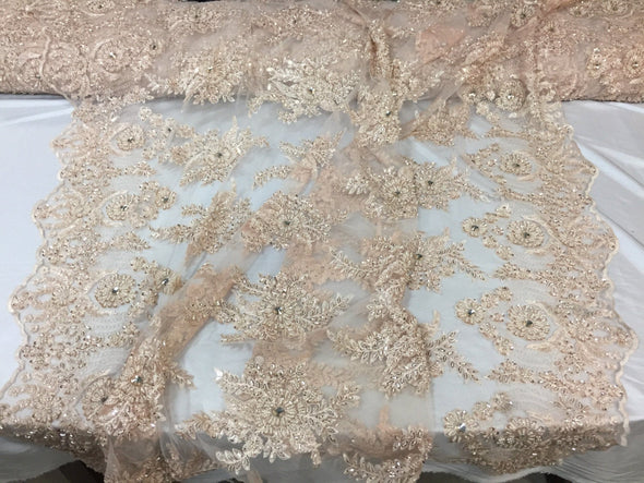 Skin imperial design embroider and beaded on a mesh lace -yd