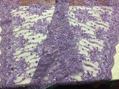 Lavender magnificent design embroider and heavy beaded on a mesh lace -Sold by the yard