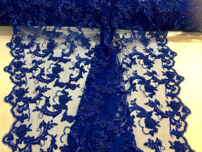 Amazing royal blue pearl design embroider and heavy beaded on a mesh lace-prom-nightgown-decorations-sold by the yard.