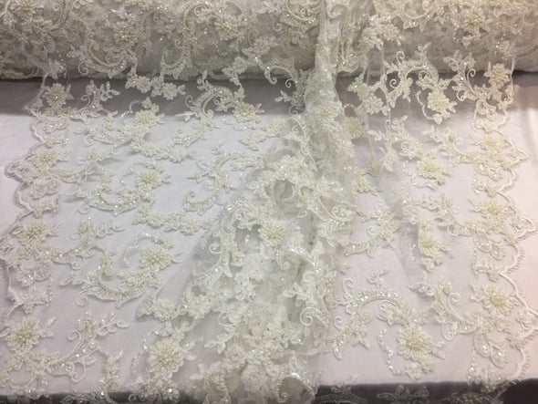 Amazing ivory pearl design embroider and heavy beaded on a mesh lace-prom-nightgown-wedding-bridal-decorations-sold by the yard.