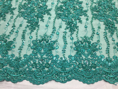 Jade magnificent design embroider and heavy beaded on a mesh lace -Sold by the yard