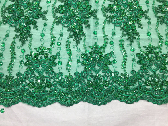 Green magnificent design embroider and heavy beaded on a mesh lace -yard