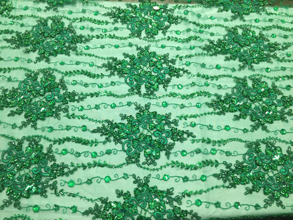 Green magnificent design embroider and heavy beaded on a mesh lace -yard