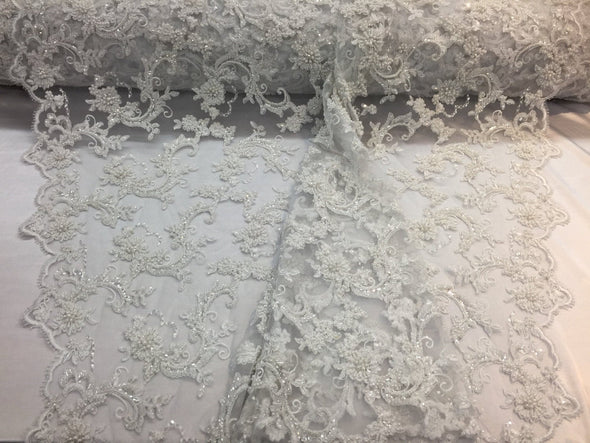 Amazing white pearl design embroider and heavy beaded on mesh lace-wedding-bridal-nightgown-prom-apparel-fashion-dresses-sold by the yard.
