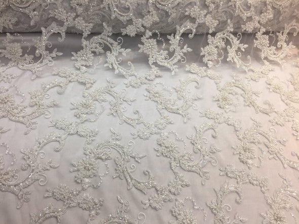 Amazing white pearl design embroider and heavy beaded on mesh lace-wedding-bridal-nightgown-prom-apparel-fashion-dresses-sold by the yard.