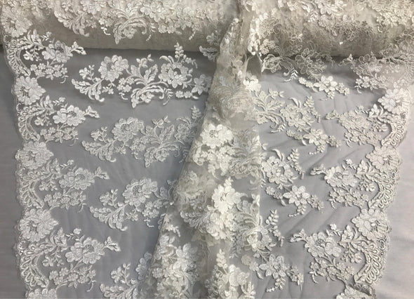 Ivory floral design embroider and corded on a mesh lace fabric-prom-nightgown-decorations-fashion-apparel-dresses-sold by the yard.