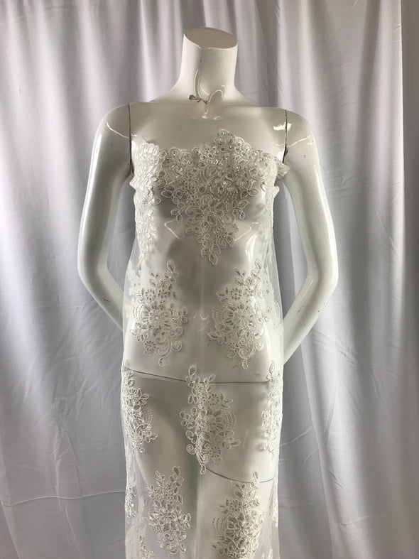Ivory flower lace carded and embroider with sequins on a mesh. Wedding/bridal/prom/nightgown fabric-dresses-apparel-fashion-Sold by the yard