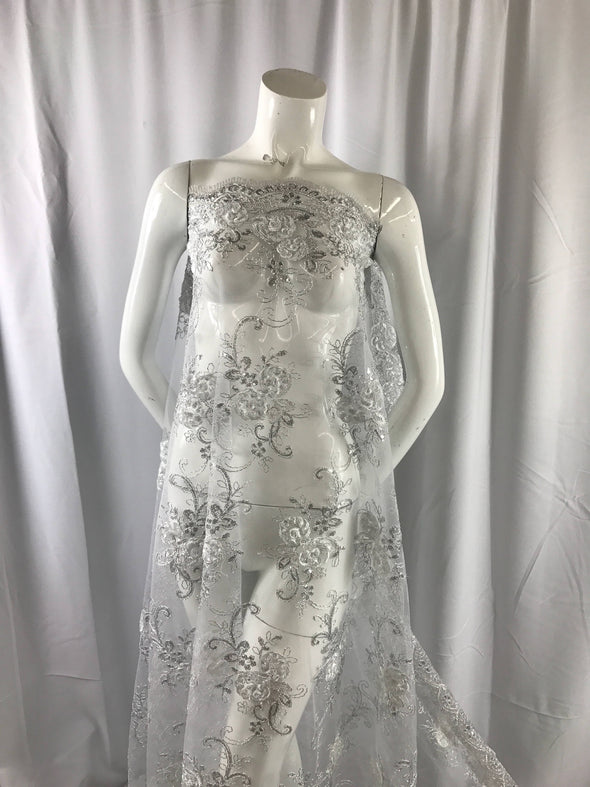 White/silver 3d flowers embroider with sequins on a white mesh lace. Wedding/bridal/prom/nightgown fabric-dresses-fashion-Sold by the yard.