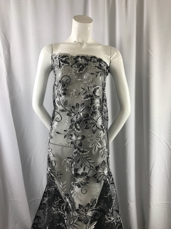 Black/ white modern flower design embroider on a mesh with sequins and metallic cord-prom-nightgown-decorations sold by the yard.