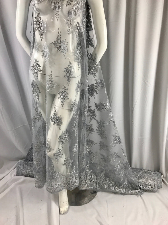 Gray paisly flowers embroider and corded with metallic silver tread on a mesh lace-wedding-bridal-prom-nightgown-dresses-sold by the yard.