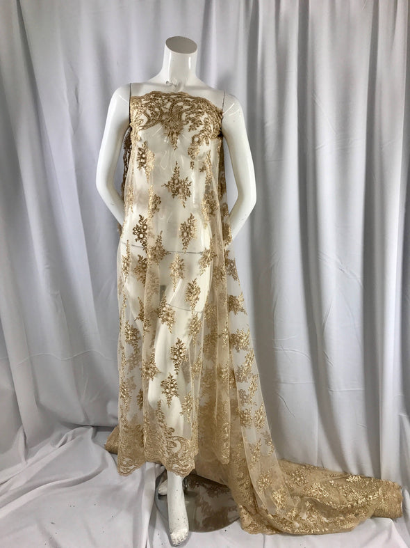 Gold paisley flower embroider and corded with a metallic gold tread on a mesh lace-wedding-bridal-prom-nightgown-decorations- sold by yard.