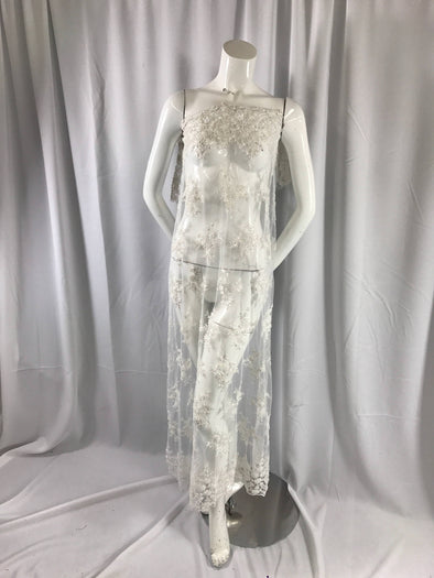 Luxurious white French design embroider and beaded on a mesh lace. Wedding/Bridal/Prom/Nightgown fabric-dresses-sold by the yard.